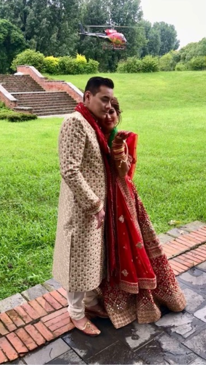 Luxury helicopter arrival for a mountain-top wedding ceremony.