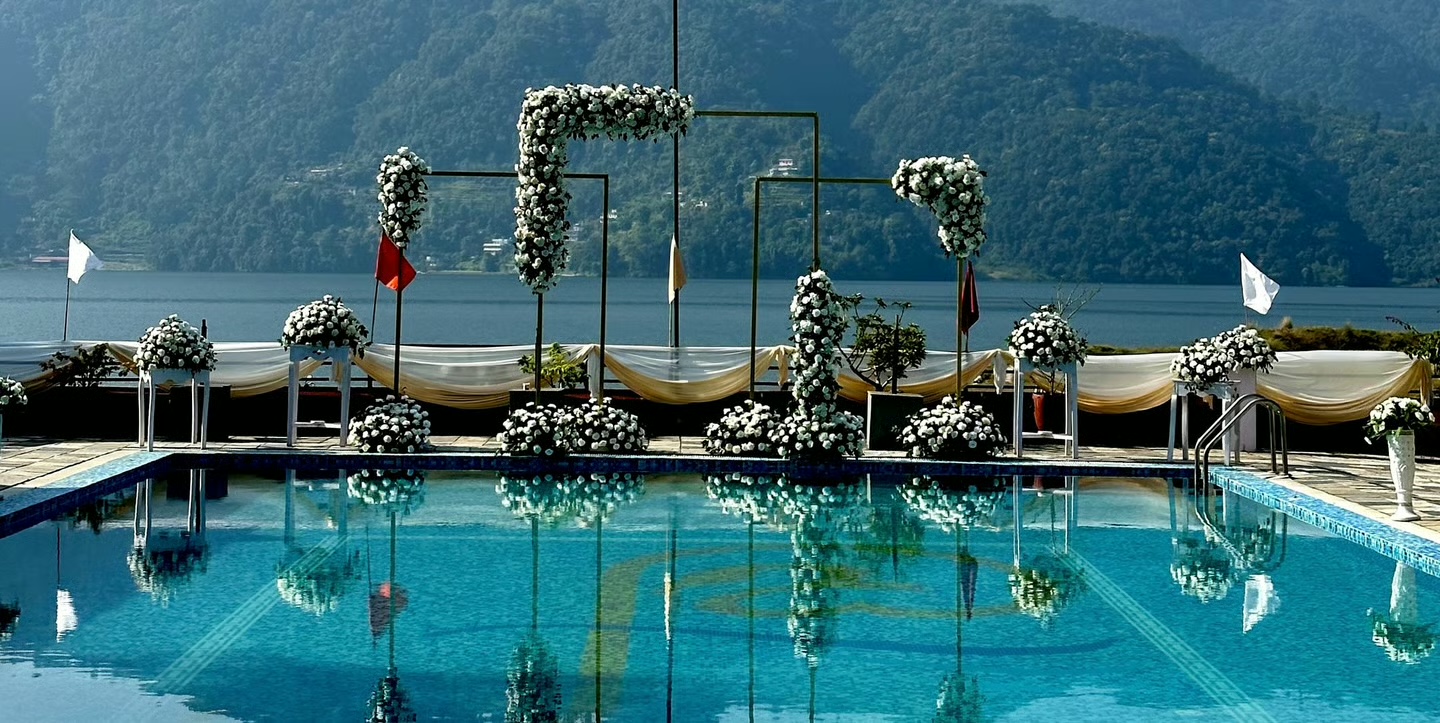 Destination wedding setup in Pokhara with lake views.