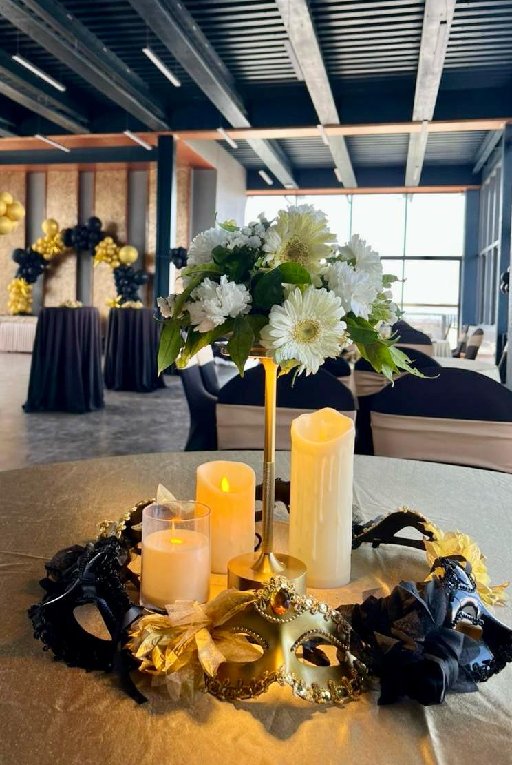 Masquerade themed wedding dinner table centerpiece