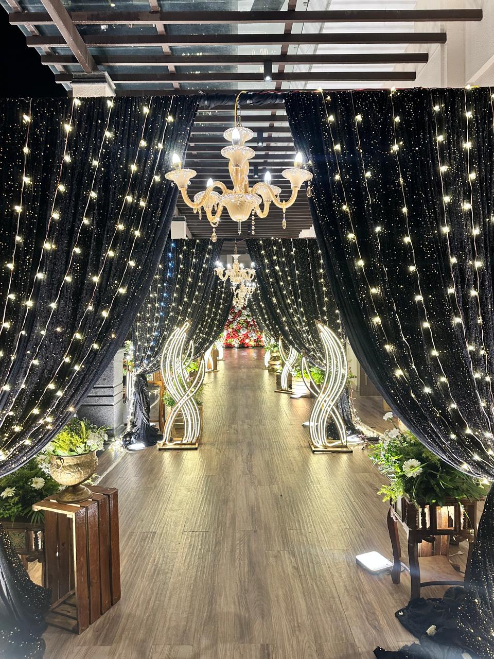 Luxury corridor pathway decorated with starry curtains and chandeliers